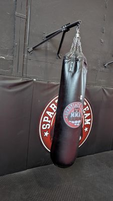 a punching bag hanging on a wall in a gym