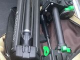 two tripods and a camera in a bag