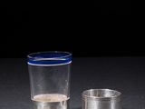 a shot glass and a shot glass sitting on a table