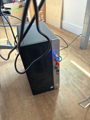 a computer that is sitting on the floor in the room