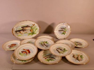 a lot of plates with fish on them on a table