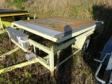a table that is sitting in the middle of a field