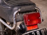 a close up of a motorcycle with a number plate on it