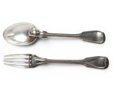two silver spoons and a fork on a white surface