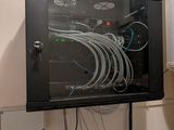 a black cabinet with wires on it in a room
