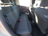 the back seats of a car with a seat belt in the back