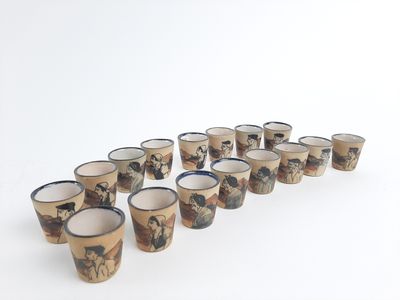 six cups with a picture of horses on them are lined up in a row