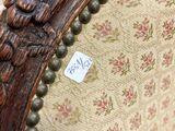 a close up of a chair with a sticker on it