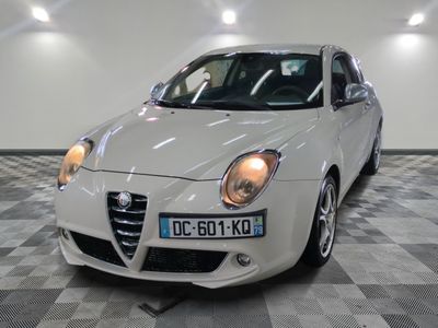 a picture of a white car parked in a garage