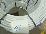 a large coil of white wires on the floor