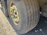 a close up of a truck tire on the road
