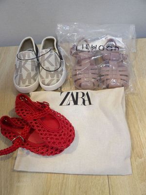 two pairs of shoes, a bag, and a pair of shoes