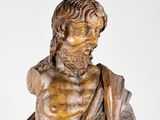 statue of a man with a beard and a book in his hands