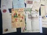 many different types of letters and papers on the table