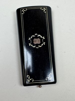 a small black book with a picture of a man on it