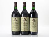 three bottles of wine sitting next to each other on a table