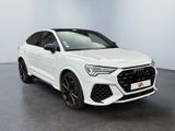 a white audi suv parked in a white room