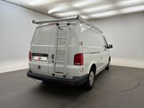 the back of a white van is parked in a garage