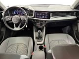 the interior of a car with a steering wheel, dashboard, and dashboard controls