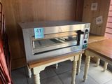 an image of a toaster oven sitting on a table
