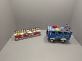 a toy train and a box of candles on a table