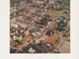 an aerial view of a city with a lot of buildings and trees