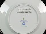 a plate with a poem on it on a black table