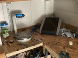 an image of a cluttered kitchen with a lot of clutter on the counter