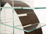 a glass shelf with a curved shelf on top of it