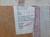 a piece of fabric that has been stitched together with a piece of paper