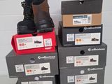 several boxes of shoes are stacked on top of each other