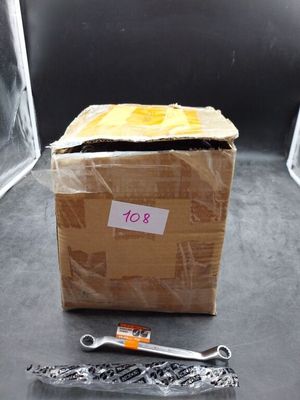a box with a piece of paper on it and a pair of scissors