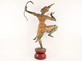 bronze statue of a man holding a bow and arrow on a wooden base