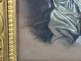 portrait of a woman in a white dress in a gold frame