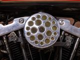 a close up of a motorcycle engine with a lot of holes on it