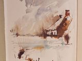une image représentant un livre sur lequel figure une maison dans la neige