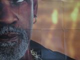the poster for the movie gladiator is displayed on the wall