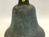 une cloche sur laquelle est dessiné un smiley