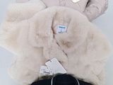 three jackets and a t - shirt are stacked on top of each other