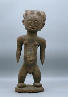 a small statue of a man with a large body