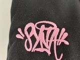 black hoodie with pink logo on the front