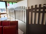 a table and chairs in a restaurant with a view of the water