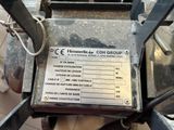 a sign on the back of a machine that is on display