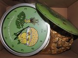 a box with a clock inside of it that has a lid on it