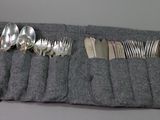 a roll up of silverware in a roll up bag
