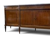 the sideboard is made of wood and has a marble top