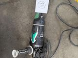 a corded drill and a corded cord on the ground
