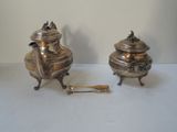 pair of antique silverplated teapots with handles and spoons