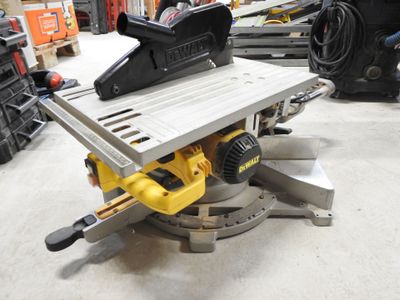 a table saw sitting on top of a table in a shop