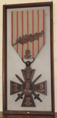 a picture of a medal hanging on a wall